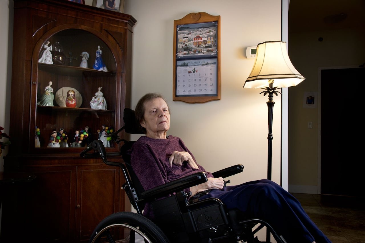 default-187 A woman in a wheelchair in front of a calendar.