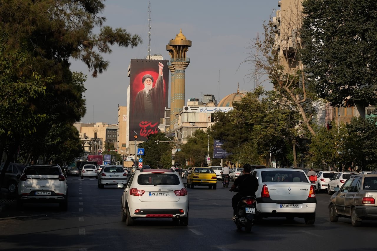 default-25 A billboard in Tehran with Farsi text: 'We must rise up.'
