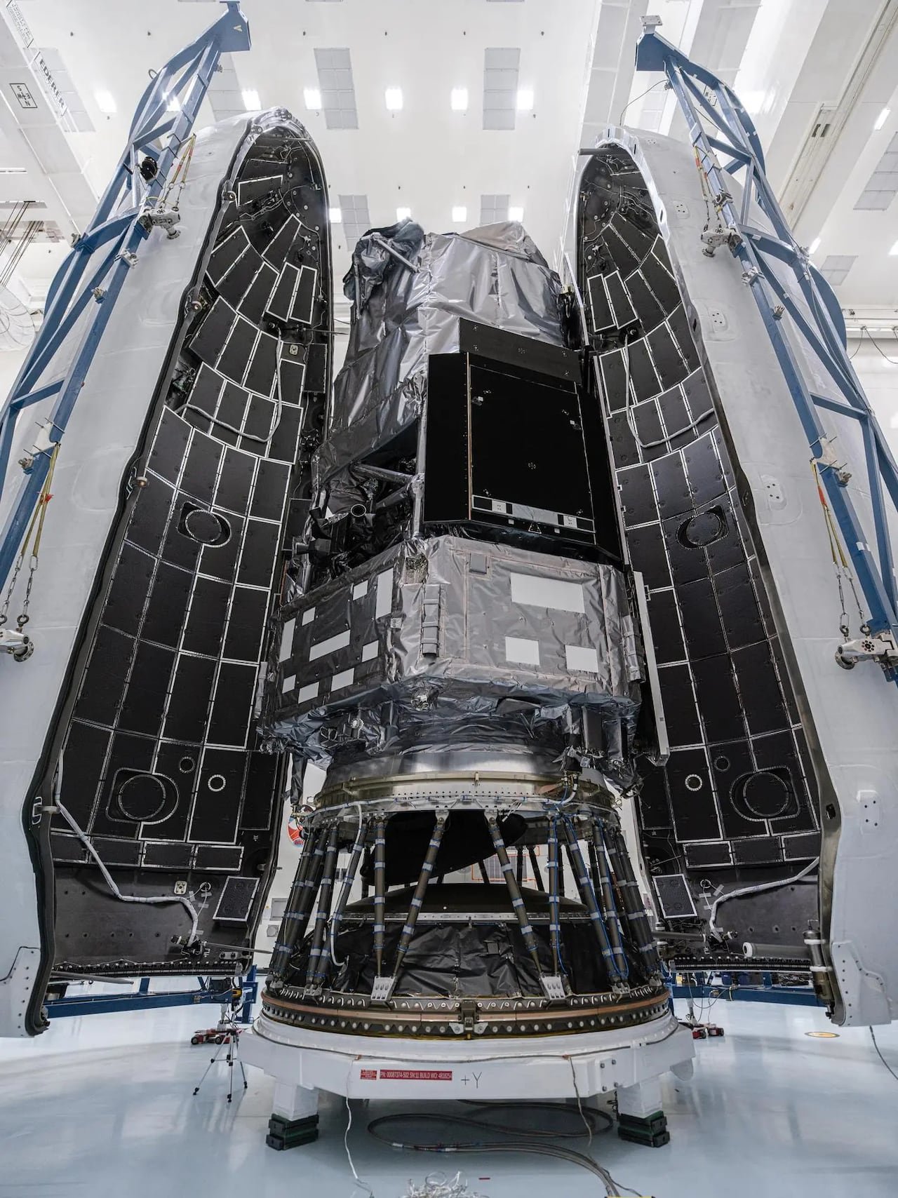 default-59 A telescope is seen inside a building being prepared to launch to space.