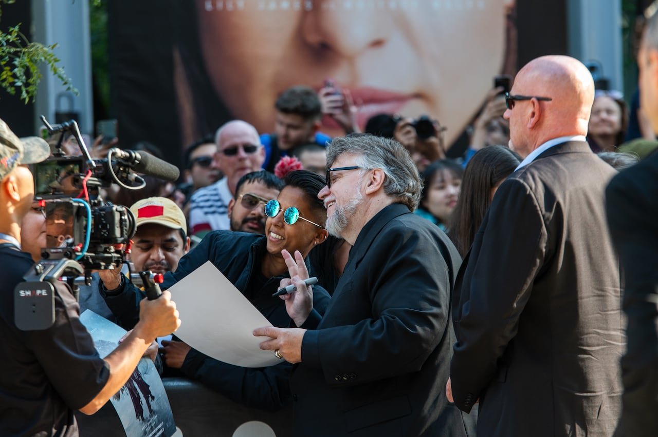 default-887 Director Guillermo Del Toro poses with a fan for a selfie on Toronto's King St.