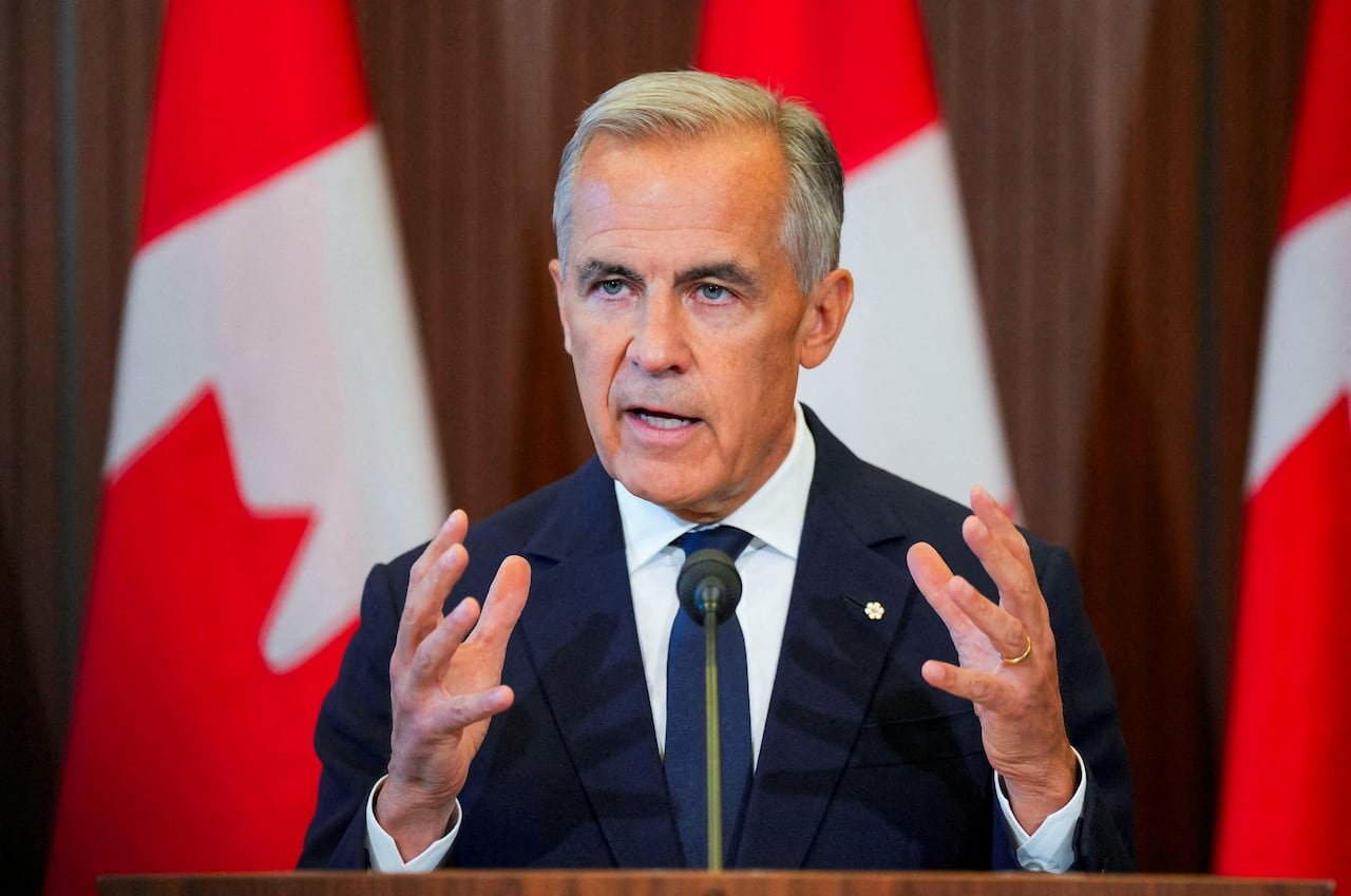 Canadaâs Prime Minister Mark Carney speaks with the news media after he suspended trade negotiations with the United States, in Ottawa, Ontario, Canada August 22, 2026.